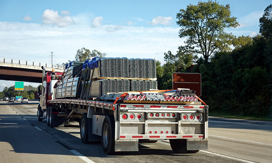 flatbed truck transporting metal sheets